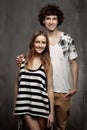 Artistic portrait of a young couple on a gray Royalty Free Stock Photo