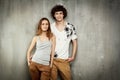 Artistic portrait of a young couple on a gray Royalty Free Stock Photo