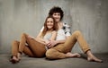 Artistic portrait of a young couple on a gray Royalty Free Stock Photo