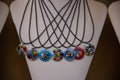 Necklaces with multicolored round pendants in Murano artistic glass. Royalty Free Stock Photo