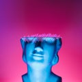 Artistic sculpture stone head with neon illumination and scribbled illustration elements. Royalty Free Stock Photo