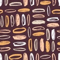 Artistic seamless pattern with vertical and horizontal rows of colorful oval stains on brown background. Modern backdrop