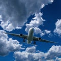 Airliner in flight with Cumulus cloud in blue sky. Australia. Royalty Free Stock Photo