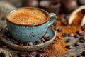Artistic still life of coffee a cup surrounded by coffee beans and ground coffee on table Royalty Free Stock Photo