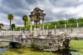 Artistic stone building in the center of an artificial lake full