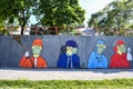 Artistic street graffiti of people who help fight the virus Covid-19