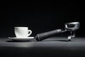 artistic studio shot of holder for coffee machine and white cup; Royalty Free Stock Photo