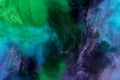 artistic texture with blue, purple and green paint swirls looks like space Royalty Free Stock Photo