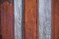 Artistic texture of an old wooden fence in black and brown tones - close-up rustic background Royalty Free Stock Photo