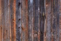 Artistic texture of an old wooden fence in black and brown tones - close-up rustic background Royalty Free Stock Photo