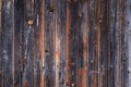 Artistic texture of an old wooden fence in black and brown tones - close-up rustic background Royalty Free Stock Photo