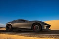 An artistic vision of a fully electric Ferrari supercar on the road