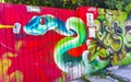 Artistic walls with snake paintings graffiti Playa del Carmen Mexico