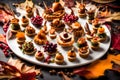 An artistically arranged platter of Thanksgiving canapÃÂ©s, showcasing miniature gourmet bites, perfect for an upscale holiday