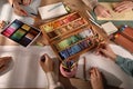 Artists drawing with soft pastels and pencils at table, above view Royalty Free Stock Photo