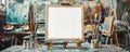 Artists easel with blank white canvas for mock up surrounded by paintbrushes and tubes of paint in creative studio Royalty Free Stock Photo