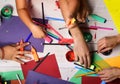 Artists hands with stationery and colored paper Royalty Free Stock Photo