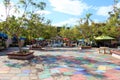 Artists painting in the brightly colored plaza of the Spanish Village Art Center at Balboa Park in California