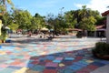 Artists painting in the brightly colored plaza of the Spanish Village Art Center at Balboa Park in San Diego