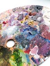 Artists palette with colors mix over white background. Modern background. Royalty Free Stock Photo