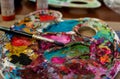 Artists Pallet with acrylic paint and a Brush Royalty Free Stock Photo