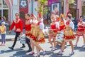 Artists in Russian national costumes on a city street during a gastronomic festival