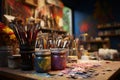 In the artists studio, a collection of paints and brushes