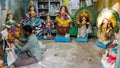 Artists working on idols of the Hindi Goddess Durga in his workshop on the streets of