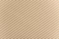 Carton or cardboard packing material. Texture of corrugated paper sheets made from cellulose. Supplies for creating boxes. Royalty Free Stock Photo