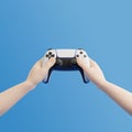 ÃÂ¡artoon hands holding a gamepad on a blue background Royalty Free Stock Photo