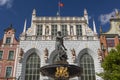 The Artus Court Dwor Artusa and Neptune Fountain in Old Town in city of Gdansk, Poland Royalty Free Stock Photo