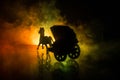 Artwork decoration. Silhouette of old coach with horse on dark toned foggy background Royalty Free Stock Photo