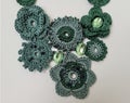 Artwork of handmade crochet, Using dark and light green color threads.