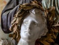 Artwork sculpture by man head with laurel wreath