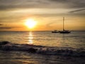 Aruba Coastal Sunset with gorgeous boat in foreground Royalty Free Stock Photo