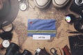 Aruba Flag Between Traveler`s Accessories on Old Vintage Map. Overhead Shot Royalty Free Stock Photo