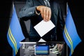 Aruba flags, hand dropping voting card - election concept