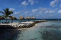 Aruba, Renaissance Island, Caribbean Sea. Sunny beach with white sand, coconut palm trees and turquoise sea. Summer vacation,