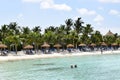 Aruba, Renaissance Island, Caribbean Sea. Sunny beach with white sand, coconut palm trees and turquoise sea. Summer vacation,