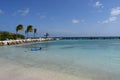 Aruba, Renaissance Island, Caribbean Sea. Sunny beach with white sand, coconut palm trees and turquoise sea. Summer vacation,