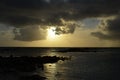 Aruba sunset with storm clouds, golden light, and ocean Royalty Free Stock Photo