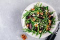 Arugula beet salad with goat or feta cheese and walnuts Royalty Free Stock Photo