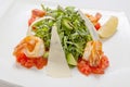 Arugula fresh salad with avocado slices with Parmesan cheese and fried shrimp flavored with balsamic vinegar Royalty Free Stock Photo