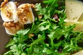 Arugula salad with goat cheese honey and nuts
