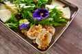 Arugula salad with goat cheese honey and nuts