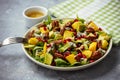 Arugula salad with mango, pomegranate, avocado, pecan nuts and blue cheese.