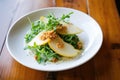 arugula salad with pear slices and gorgonzola crumble