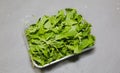 Arugula salad in the plastic box. Rucola lettuce healthy food. Vegetarian lifestyle concept. Green fresh vitamins Royalty Free Stock Photo