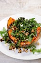 Wedge baked of pumpkin with arugula and cheese Royalty Free Stock Photo