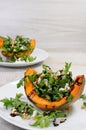 Wedge baked of pumpkin with arugula and cheese Royalty Free Stock Photo